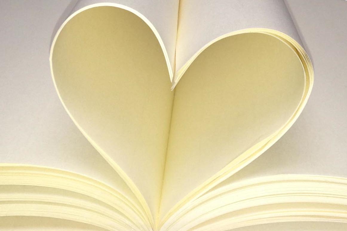 Notebook pages folded into a heart-shape